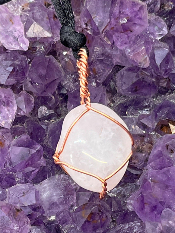 rose quartz pendant wrapped in copper wire